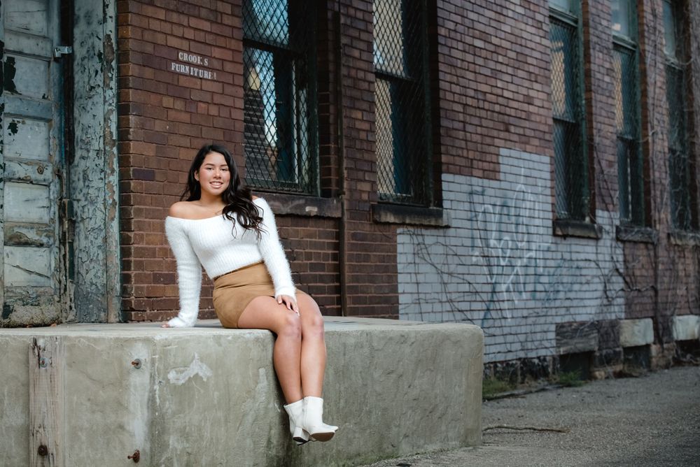 senior girl old building brick wall old door