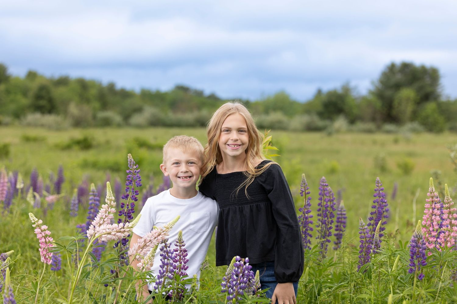 Siblings in a field of flowers