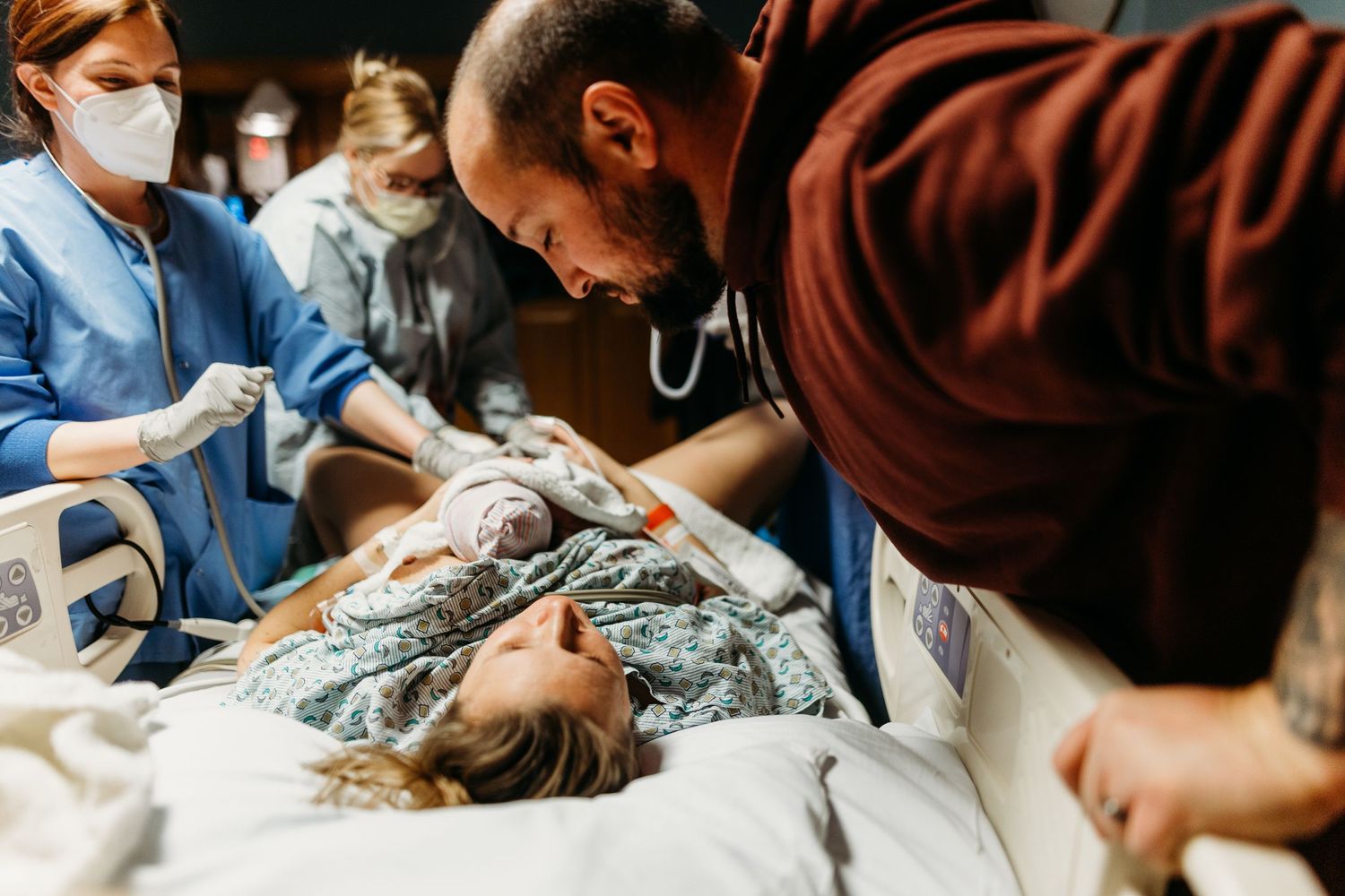 Medical professionals attending to patient in hospital setting.
