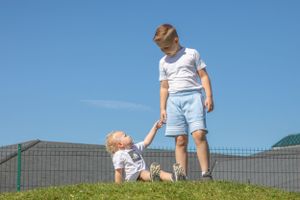 Look up to an older brother.  Photo by Casual Captures Wedding Photography