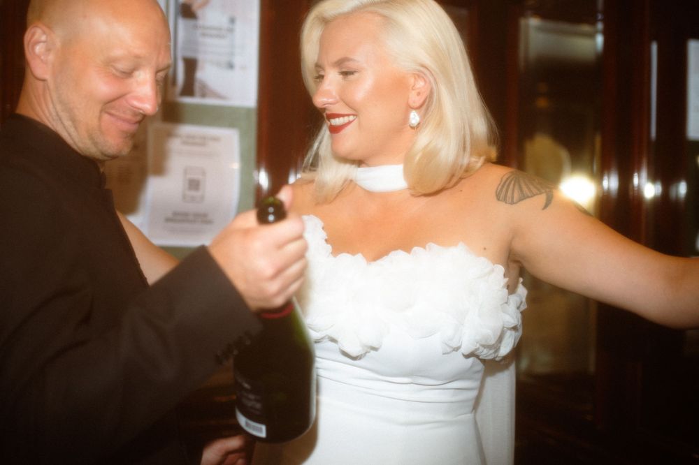 Couple shares joyful moment during wedding celebration.
