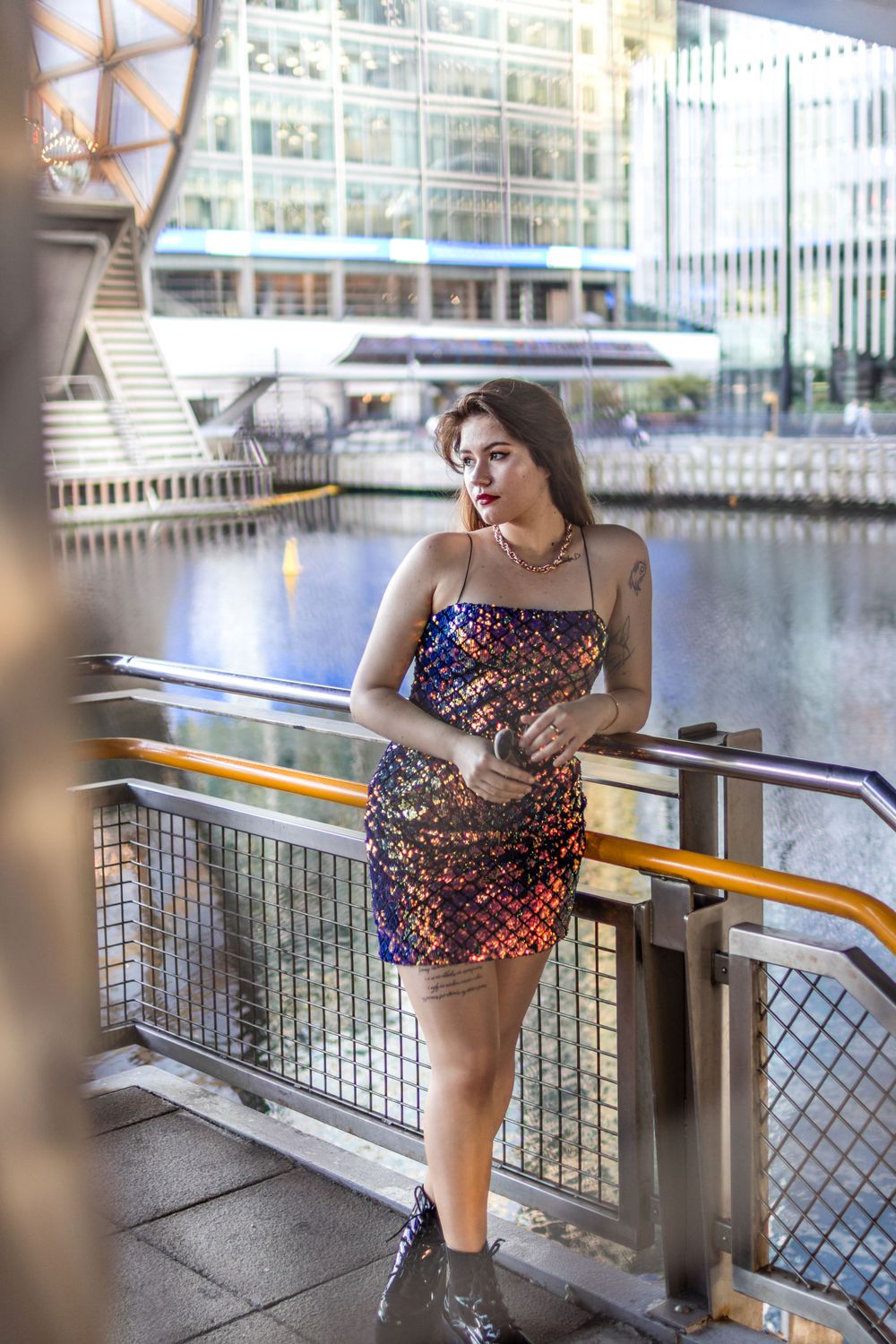 Model Beata posing for Keith Malda in a gorgeous purple sequinned dress in Canary Wharf London