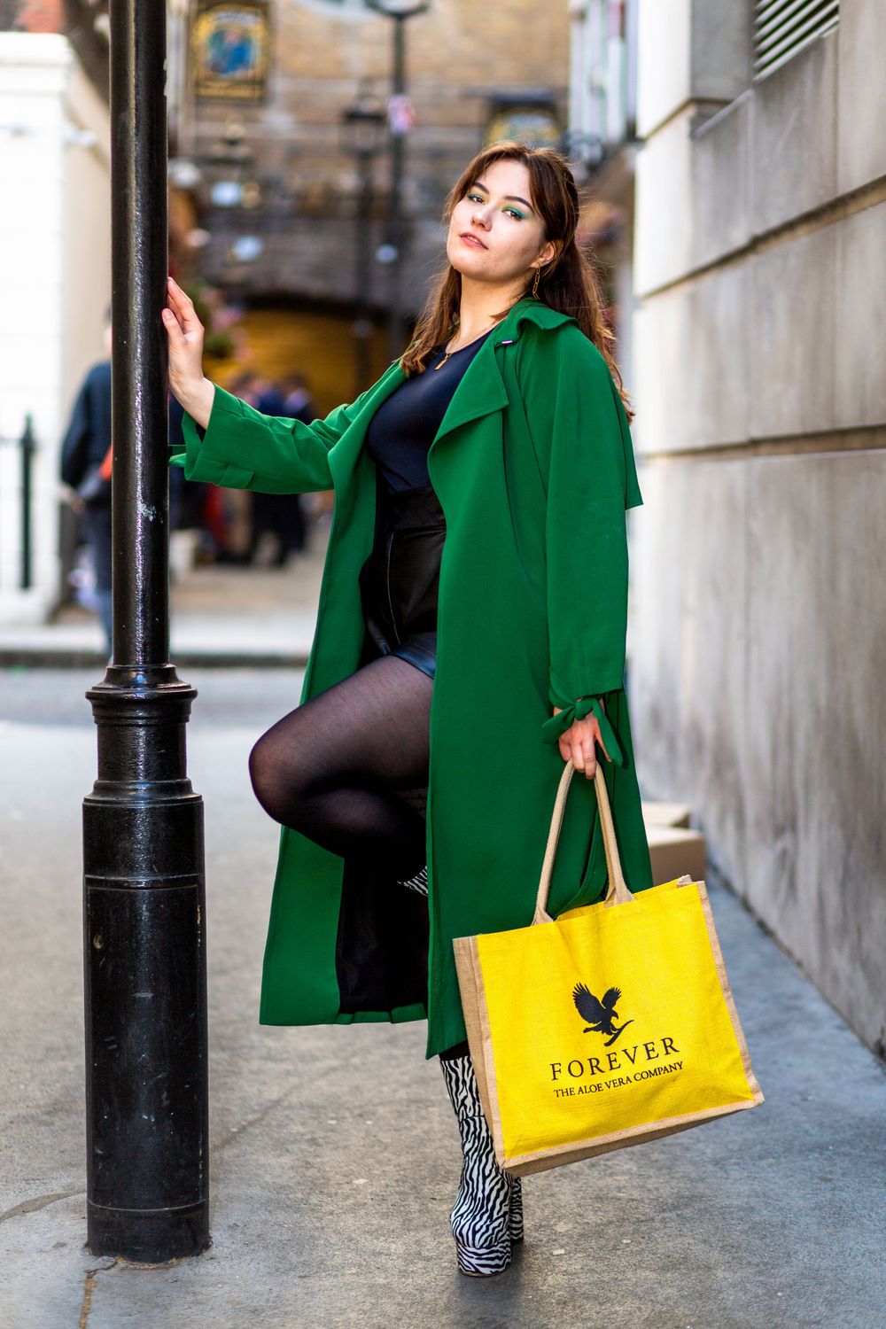 Stunning model Beata, posing for Keith Malda photography on a fashion photoshoot in London. Holding a lamppost wearing