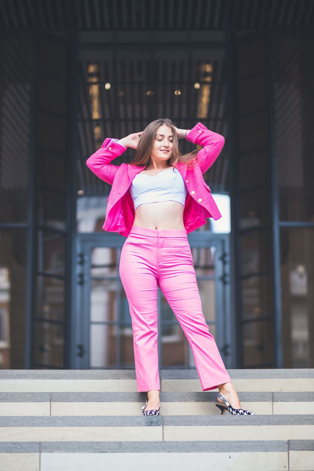 Stunning full body photograph of gorgeous Ukrainian model, Stasia, in a full pink outfit showing off her incredible body