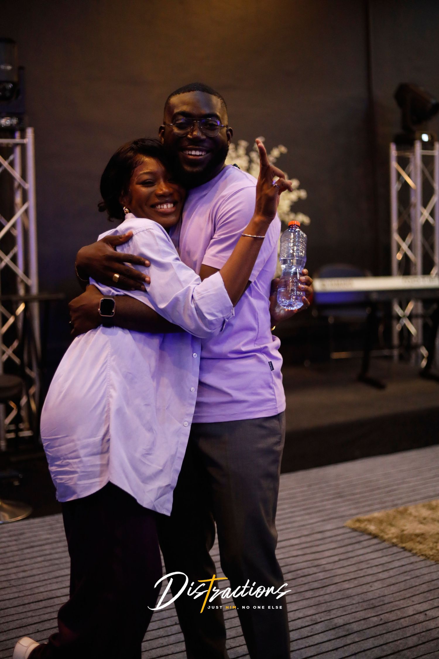 Laud Evans and Regina Tortoh( The florist) at the Distractions project by Channel Media events hugging.