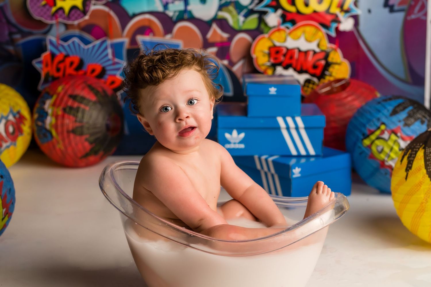 90's 1st birthday cake smash session in a Bothell studio. Fun, authentic birthday photography by Filling the Frame Photography