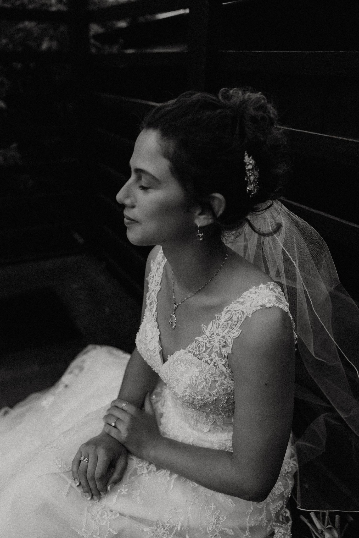 Black and white portrait of a bride in lace wedding dress with veil and floral hair accessories. New Bedford, Ma. Miranda Photo & Co