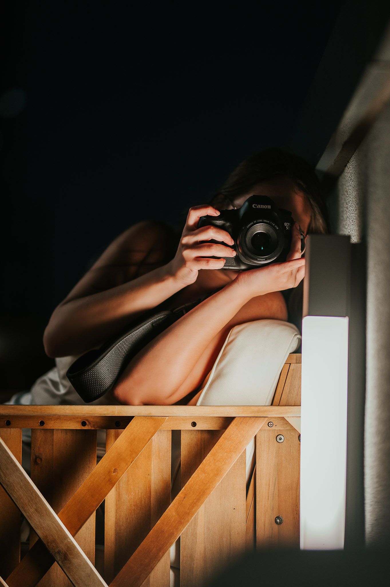 photographer igcognito with camera on face
