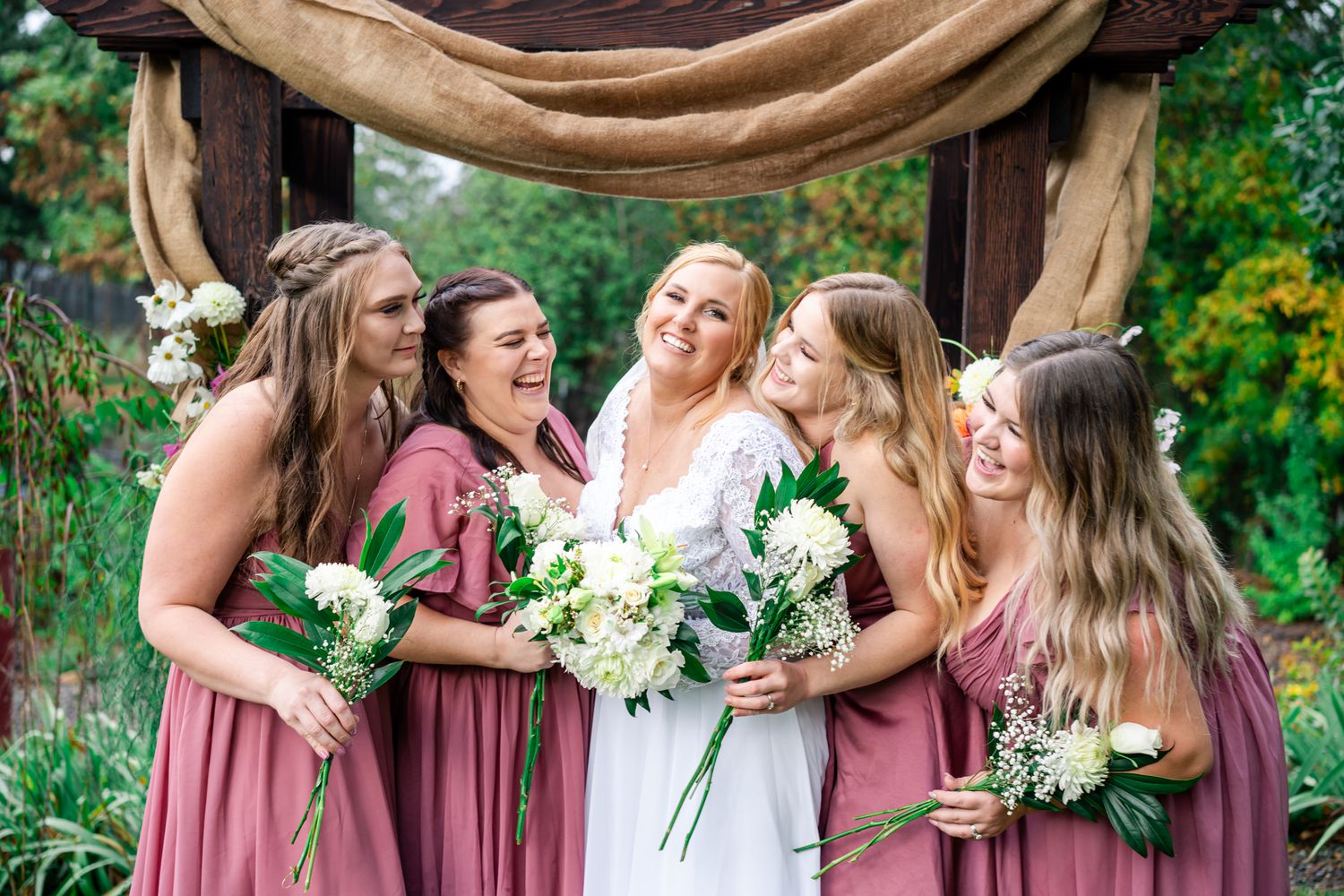 bride laughs with her girls