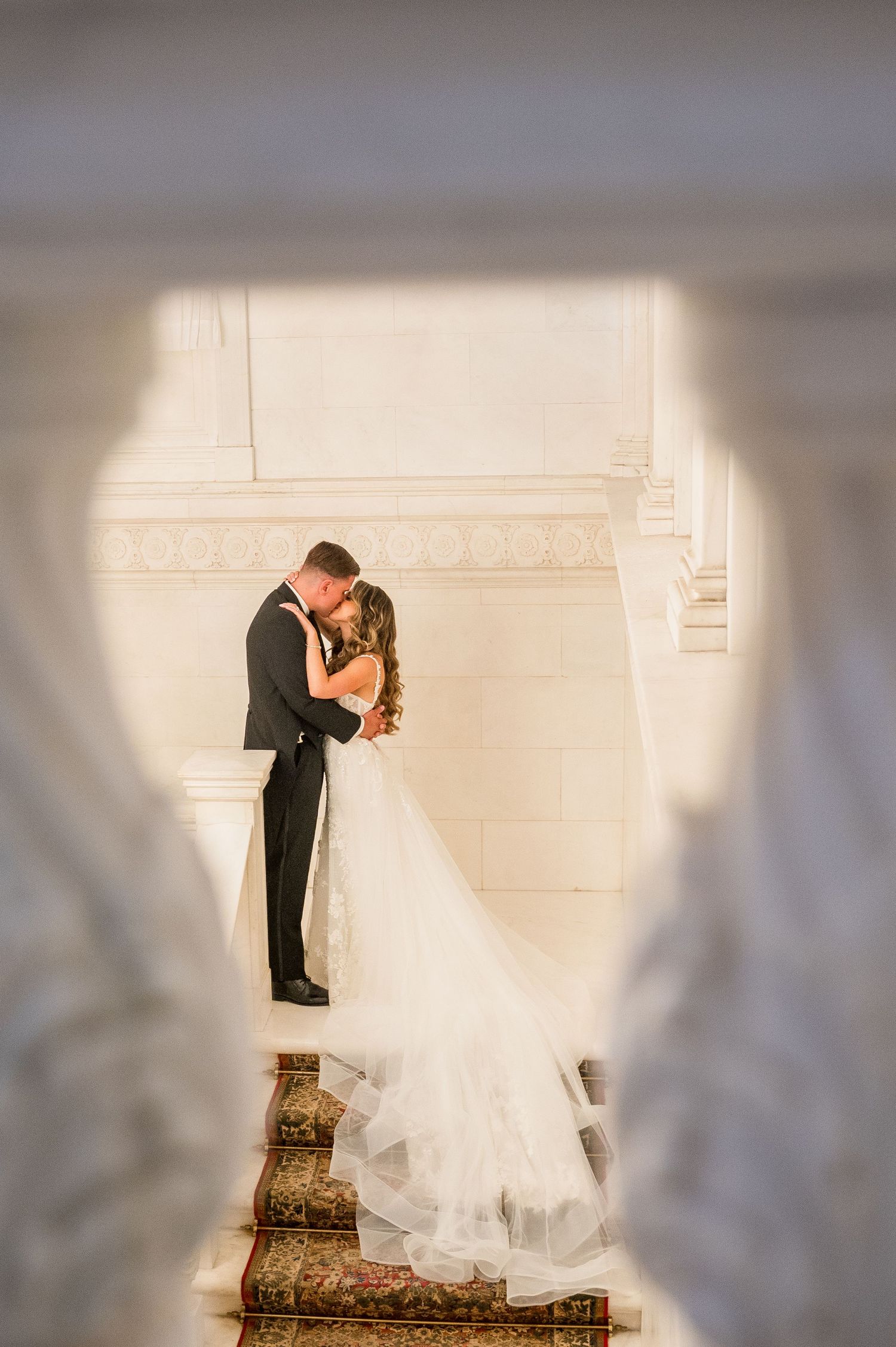 Couple kissing in the corridors of NYIT weddings.