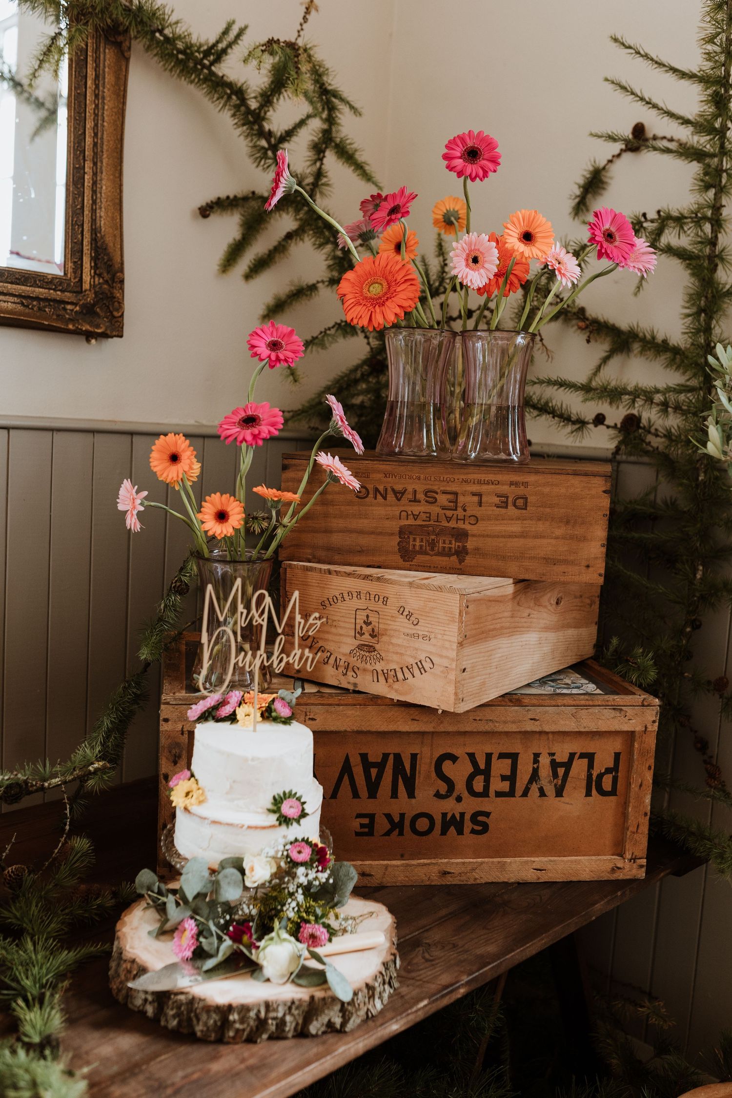 The Lychgate Cottage Tearoom wedding cake with orange and pink daisies