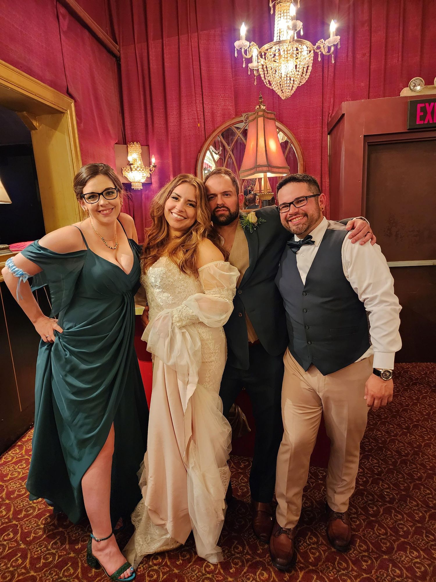 photographer Ashley D'Annunzio poses with her spouse and their friends who are the bride and groom