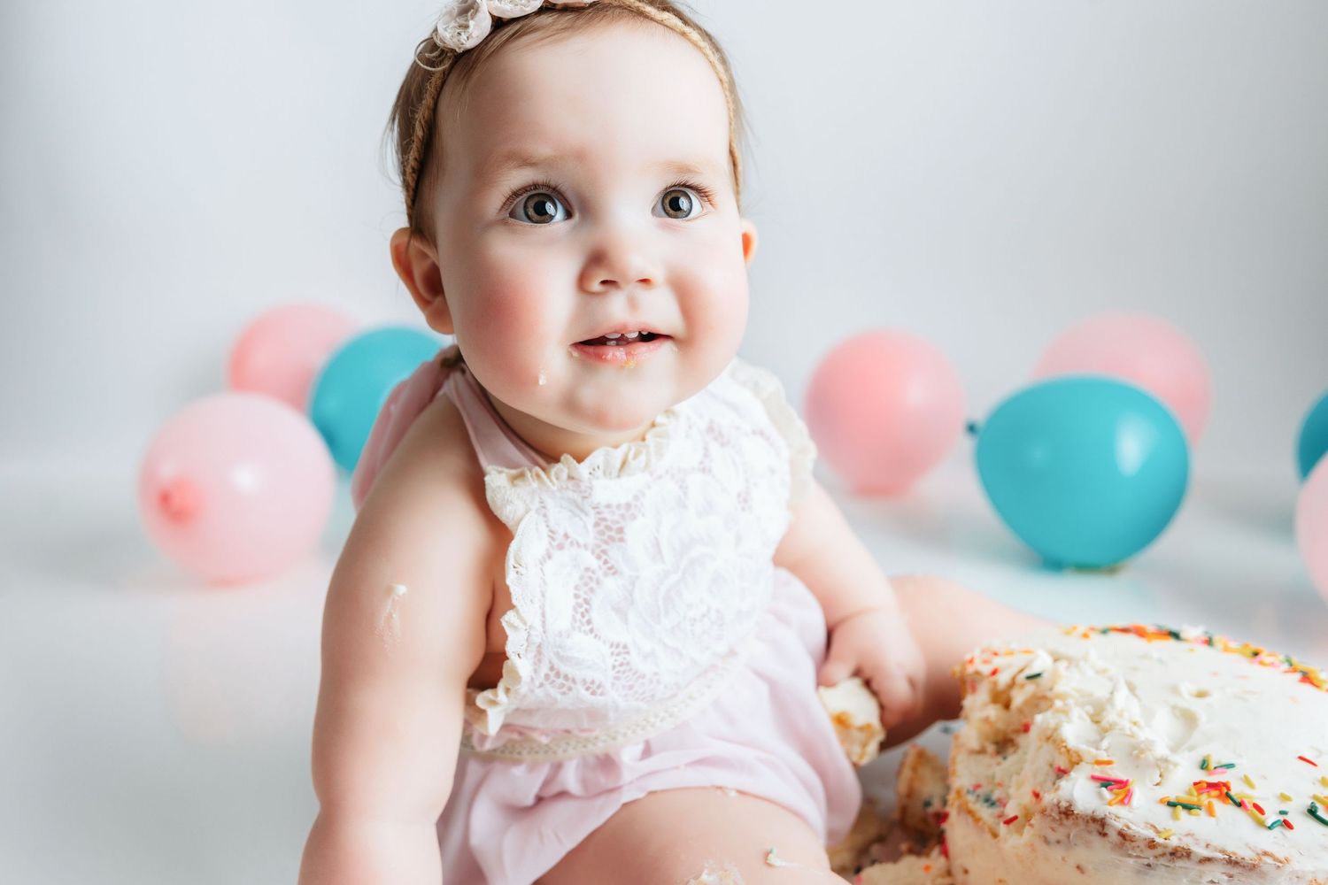 A smash the cake of a little girl. Greenville SC newborn photographer, Easley, SC newborn photographer, Upstate SC newborn