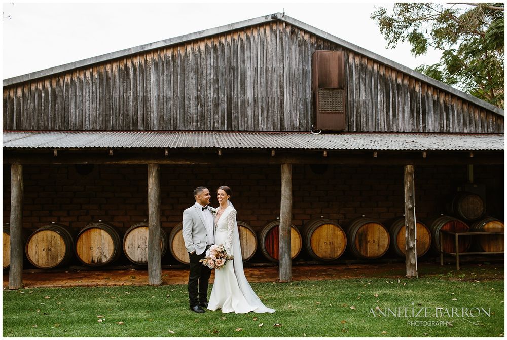 Happs Winery Wedding bride and groom in front of a barn
