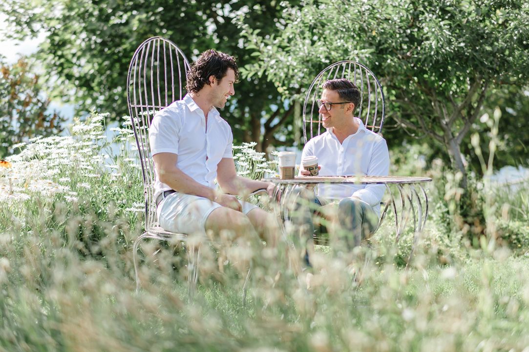 Natural outdoor setting with trees and grass for a summer photo session.