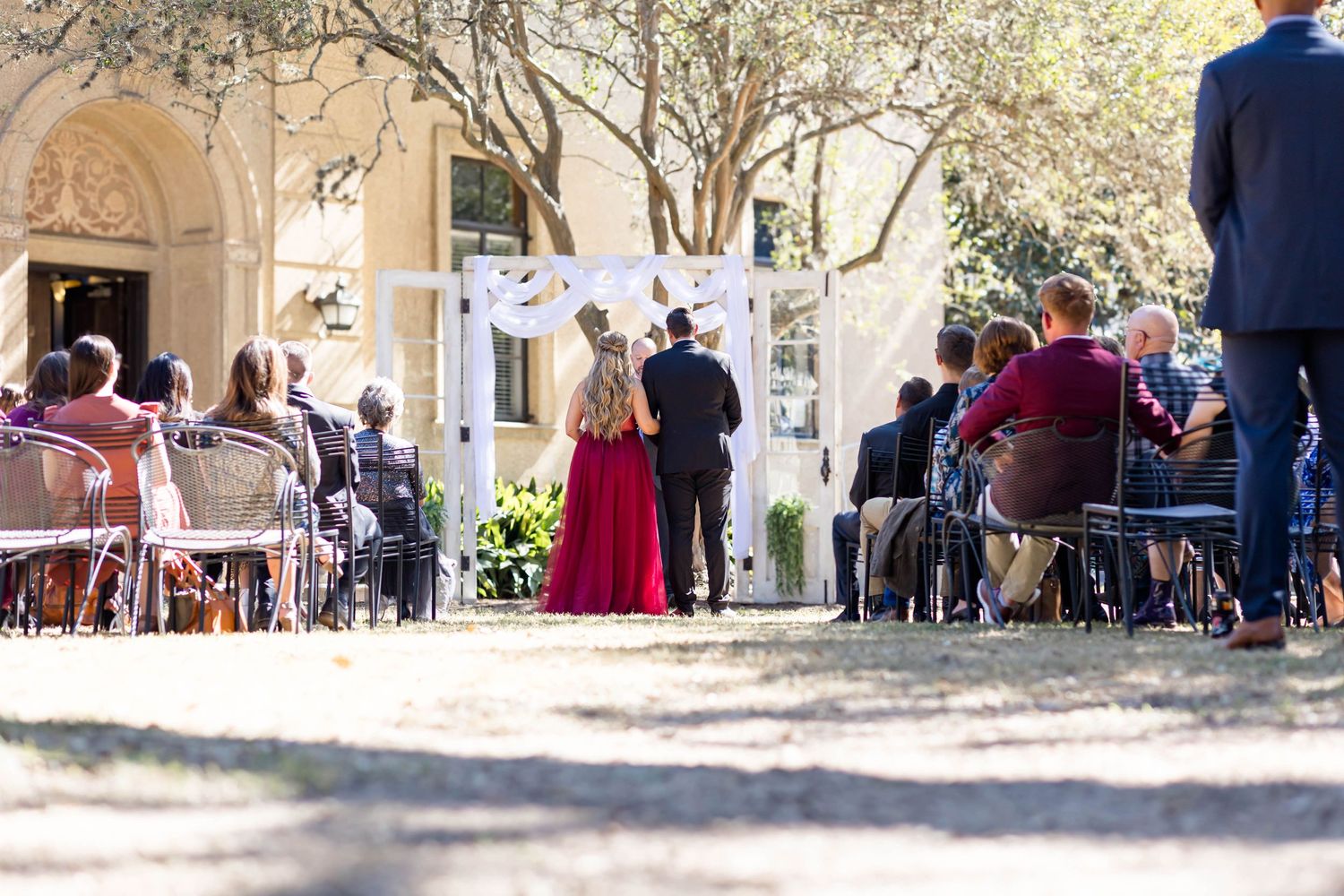 bride and groom exchange vows at the club at union square LSU