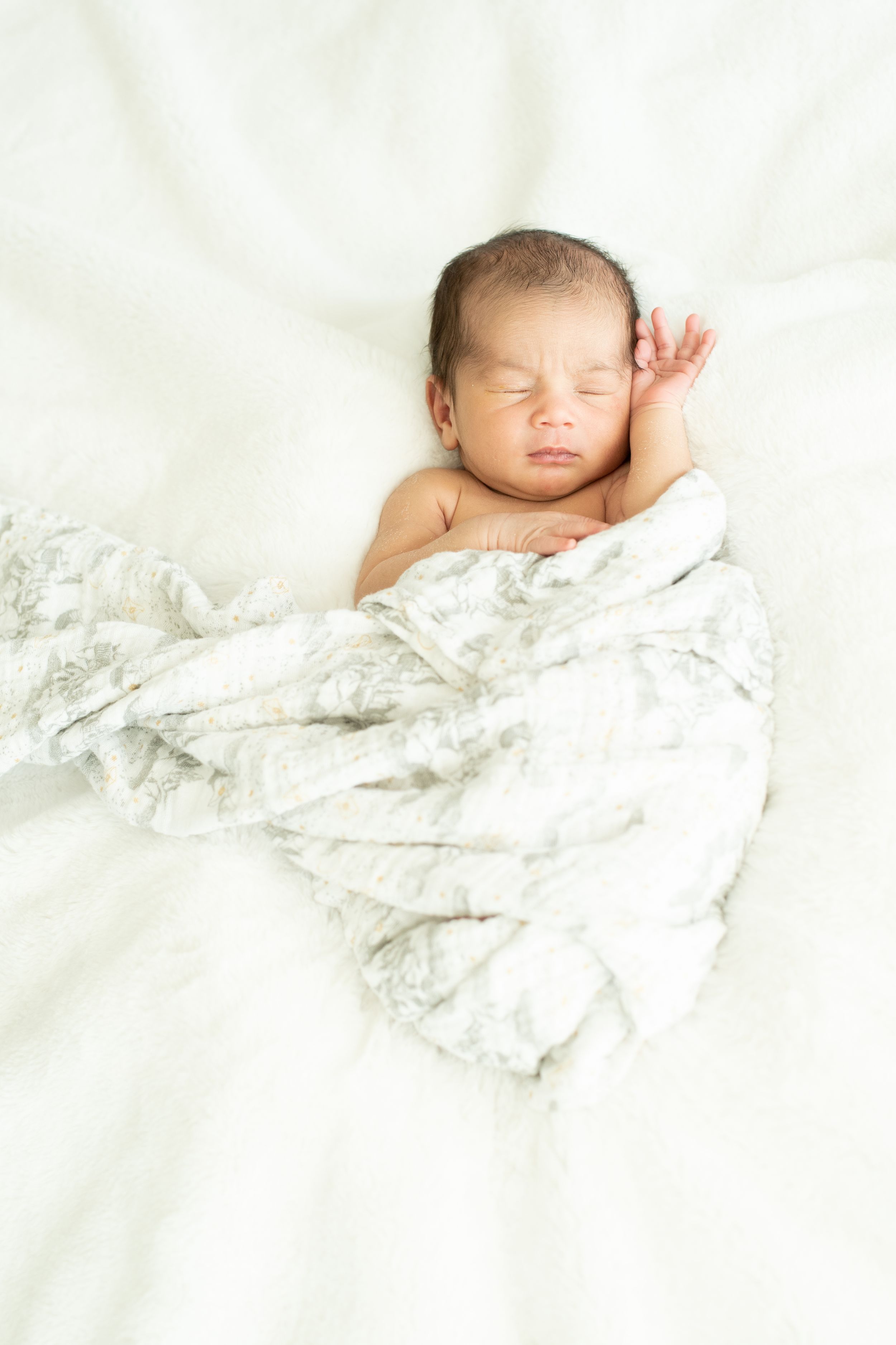 pure perfection. Newborn baby wrapped in soft cream blanket during Houston newborn photography session