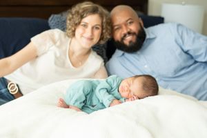 proud mama and daddy during a Houston newborn lifestyle photoshoot in Houston.