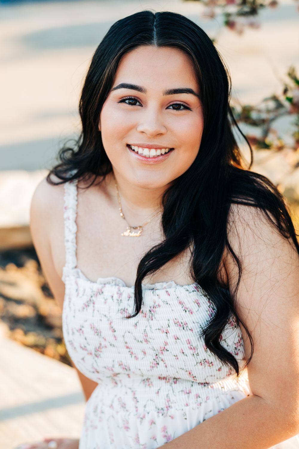 Senior girl smiling at the camera at Avila Beach, CA