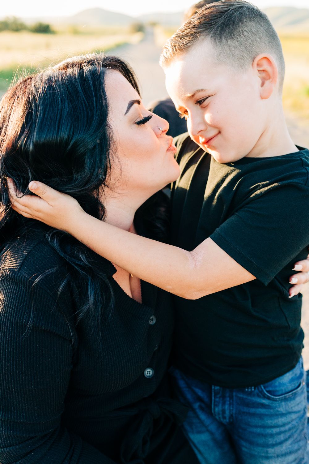 Mom making a kissy face at her son in Nipomo, CA