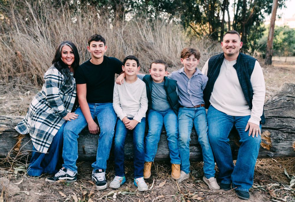 Family of 6 sitting on a log, Santa Maria, CA