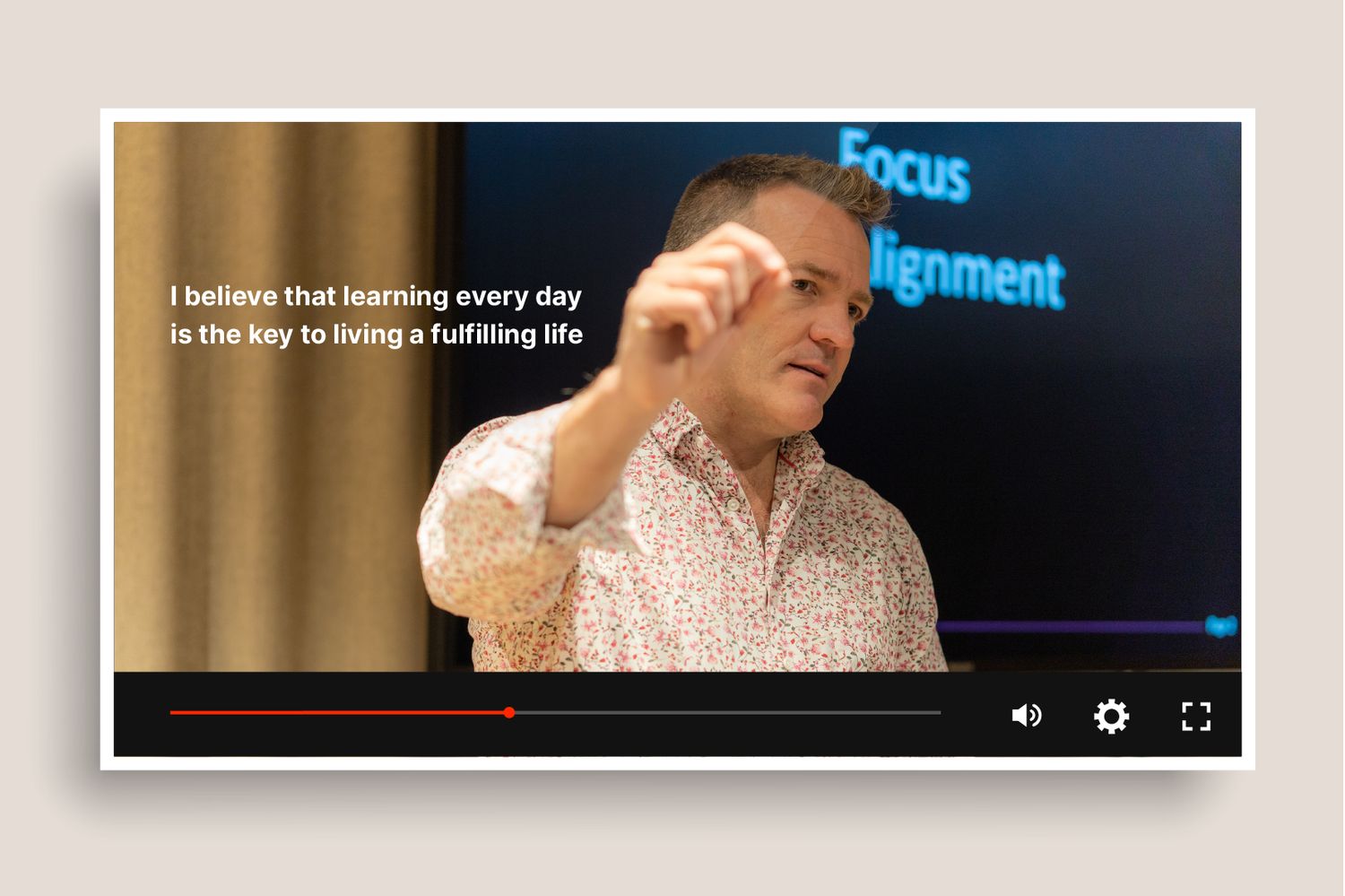 man presenting on stage video example