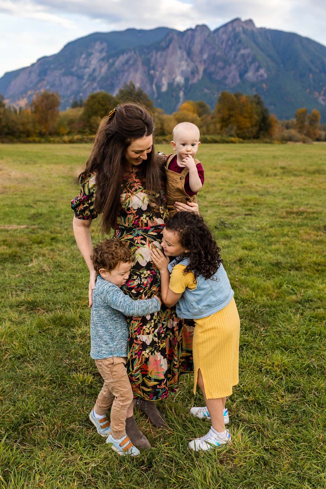 Children giving each other hugs in North Bend, Washington.