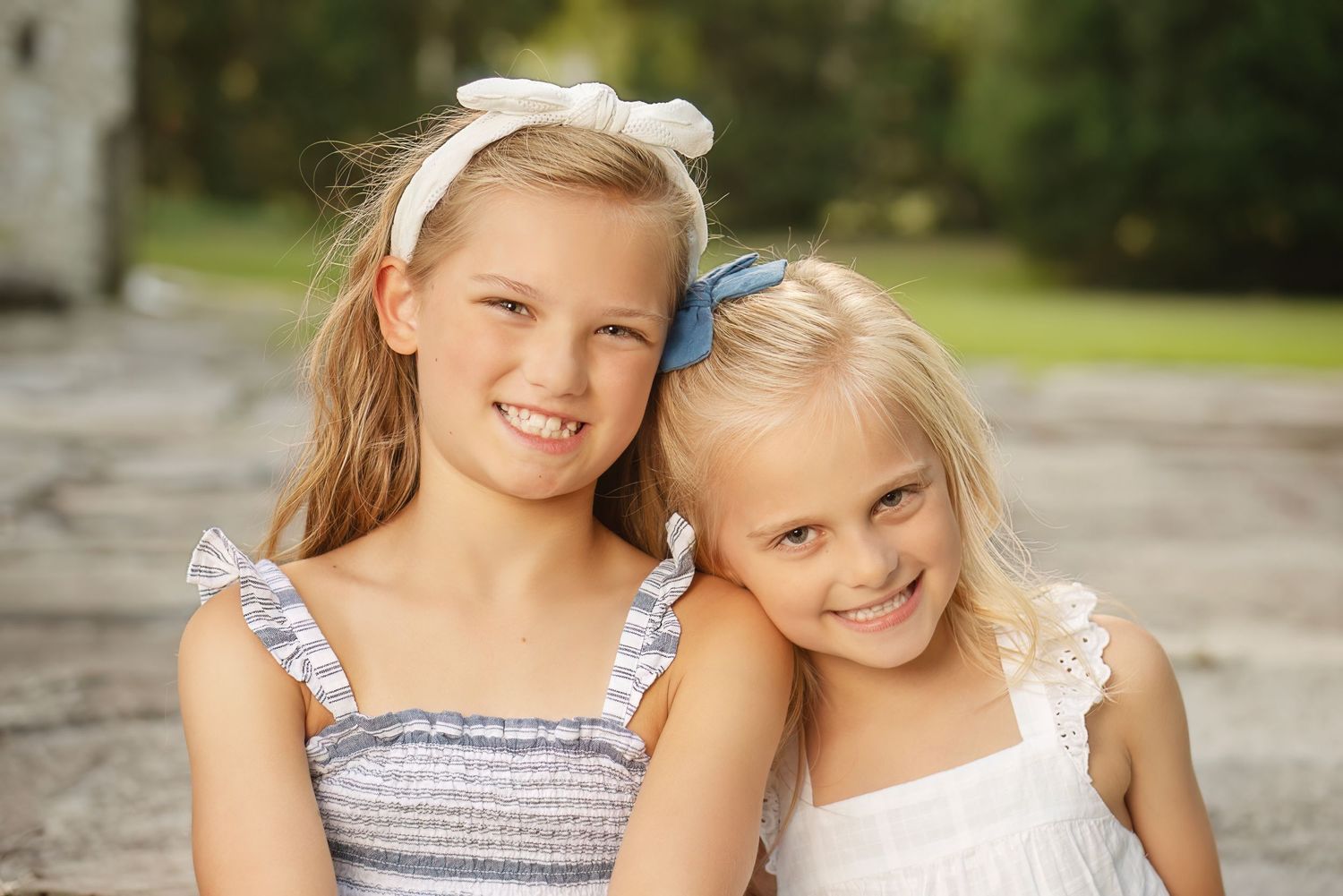 sisters lean heads together