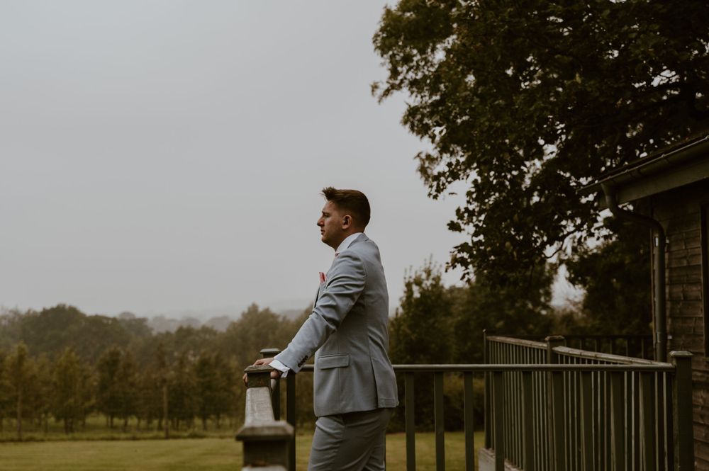 A groom looking at the view before the ceremony at Deer Park Country House