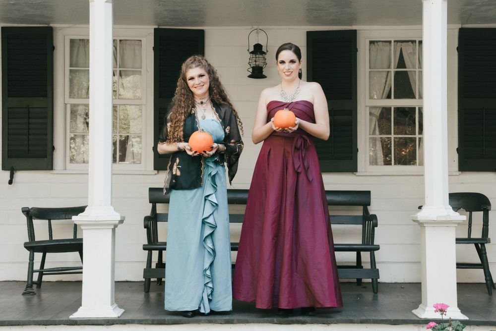 two brides holding pumpkins fall wedding , LGBT wedding in Ohio