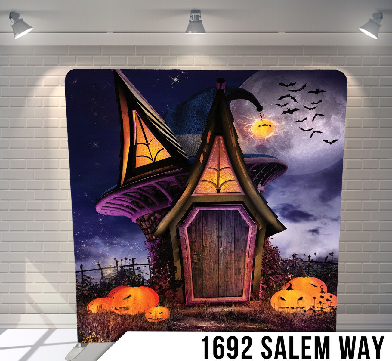 Spooky cartoon house with glowing pumpkins and bats against purple night sky.