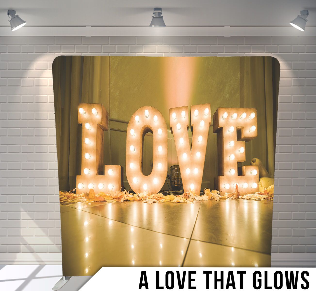 Illuminated LOVE marquee letters glowing warmly against a golden background.