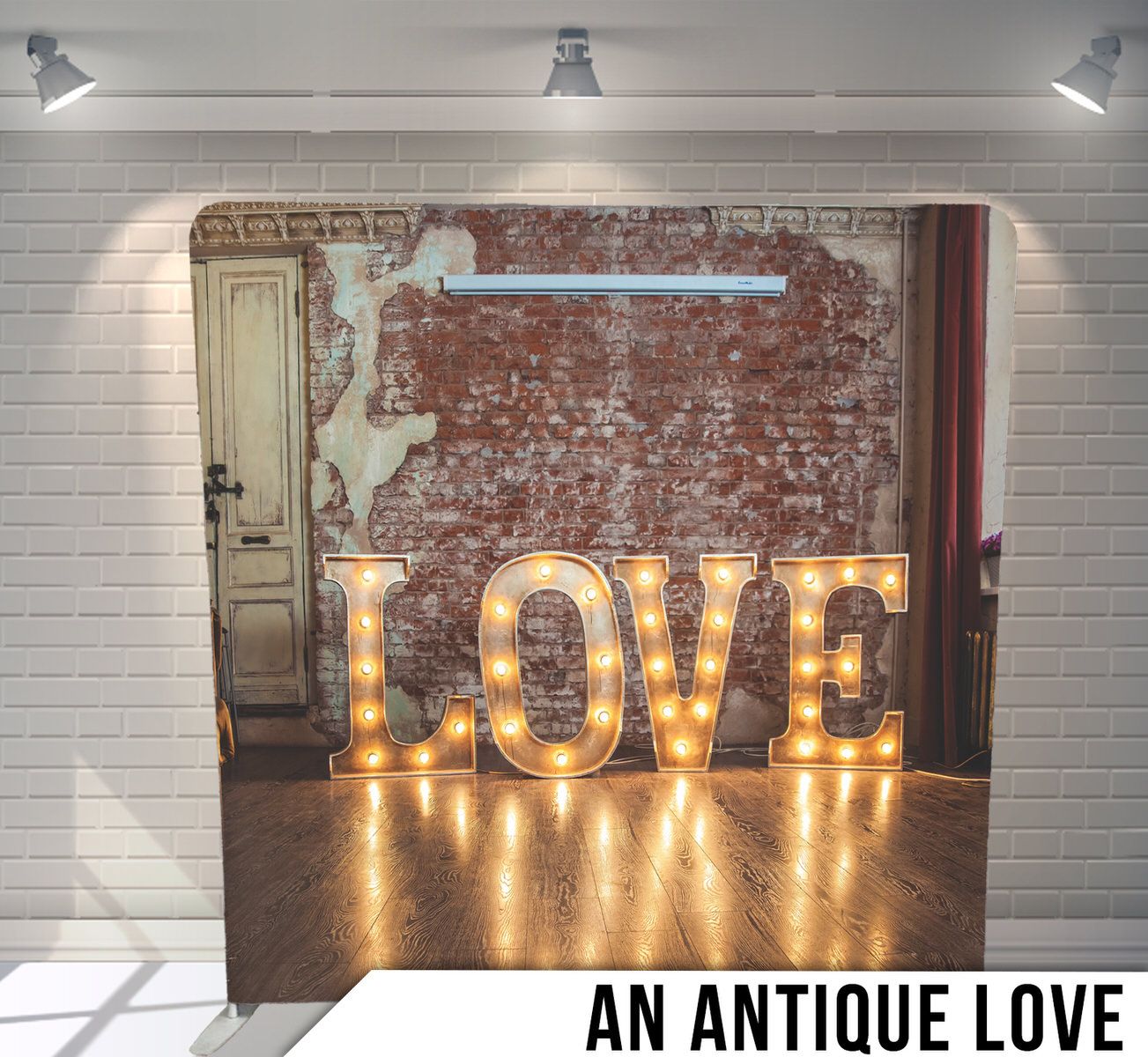 Illuminated marquee LOVE sign with glowing bulbs against a rustic brick wall and vintage door backdrop.