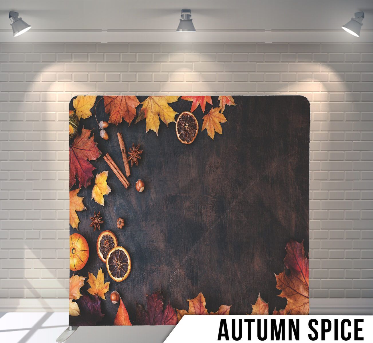 Autumn-themed background with fall leaves, spices, and pumpkin slices on dark moody surface.