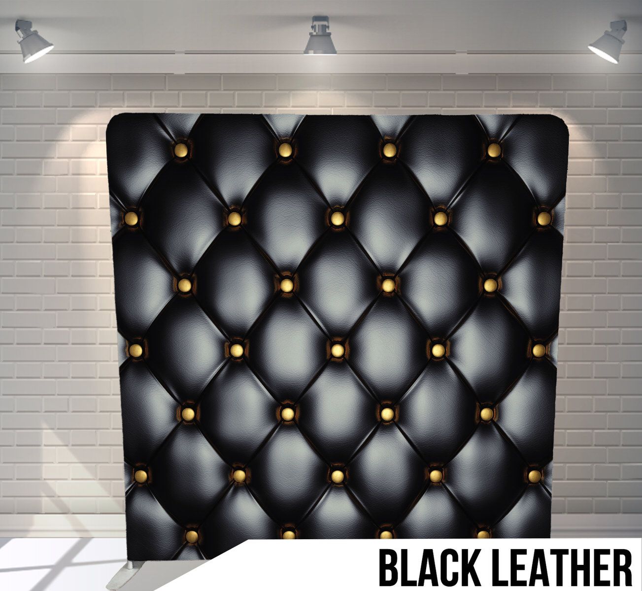 Luxurious black tufted leather texture with gold buttons creating an upholstered effect.