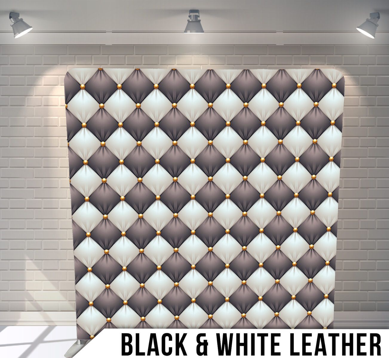 Geometric pattern of black and white leather diamonds with small triangular accents under spotlights.