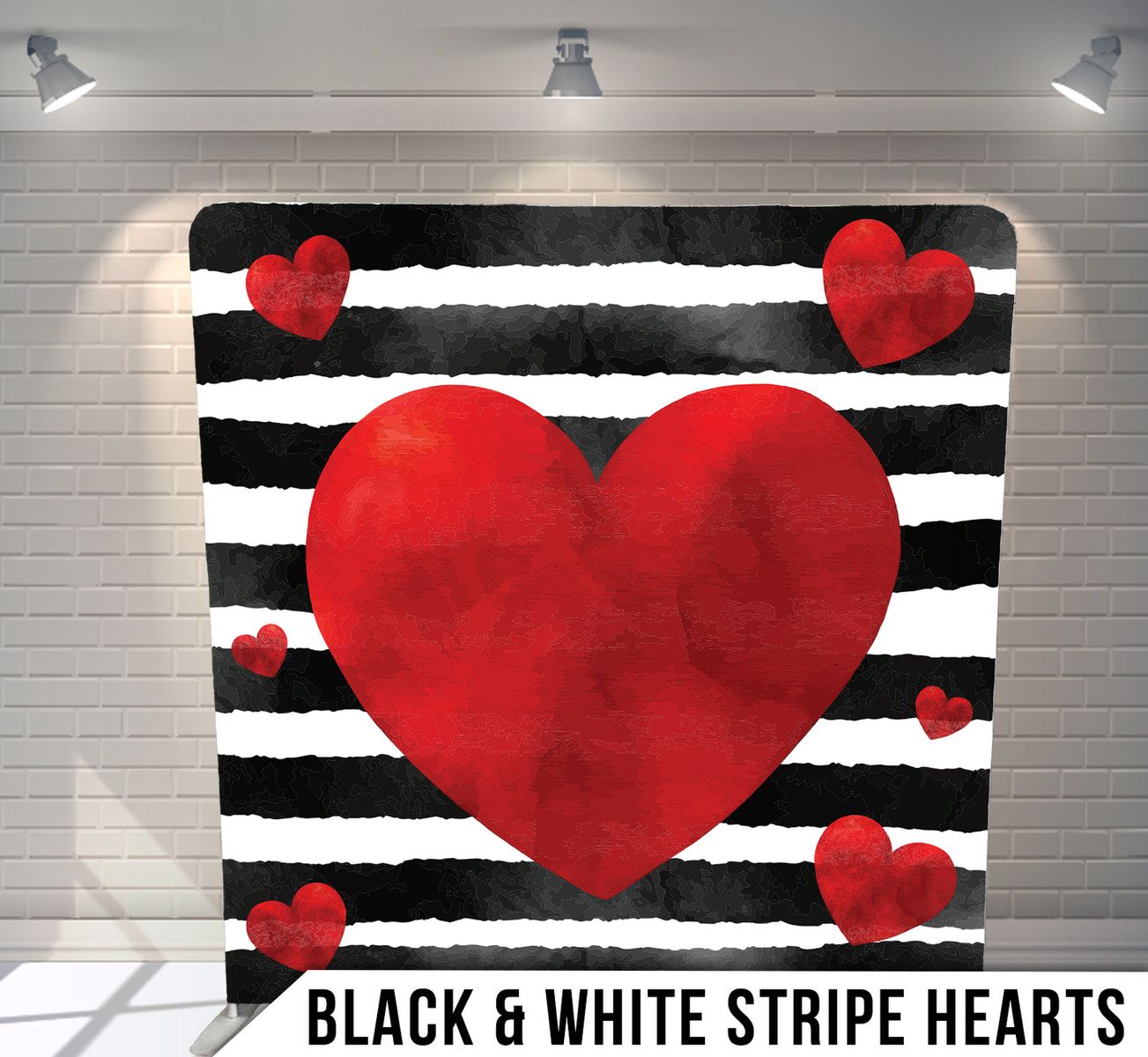 Red heart designs on black and white striped background with dramatic lighting.