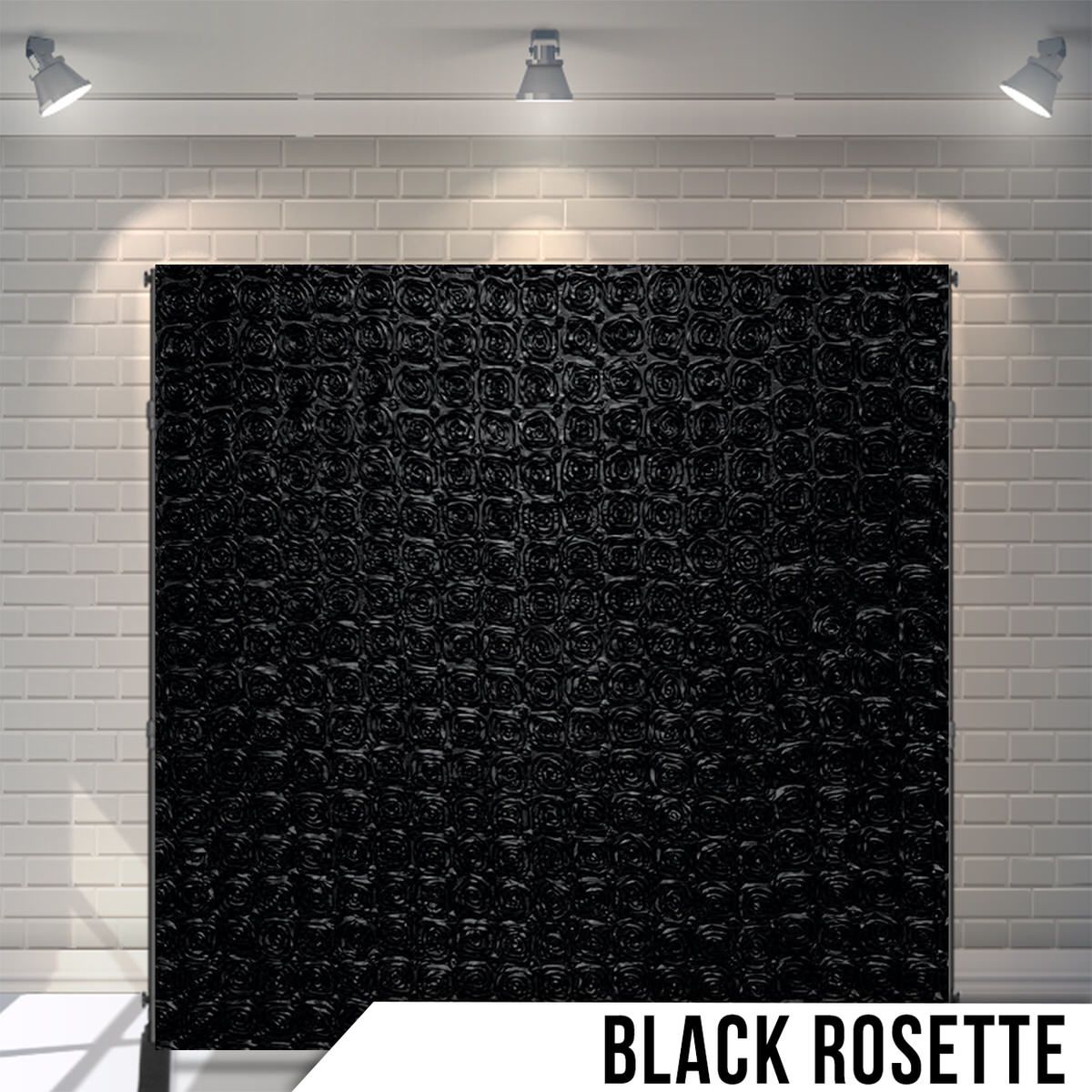 Black textured rosette pattern backdrop with elegant tufted appearance under studio lights.