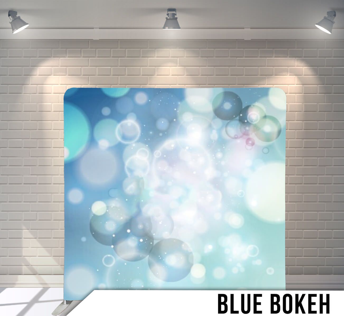 Abstract blue and white bokeh background with soft glowing circles and light effects.