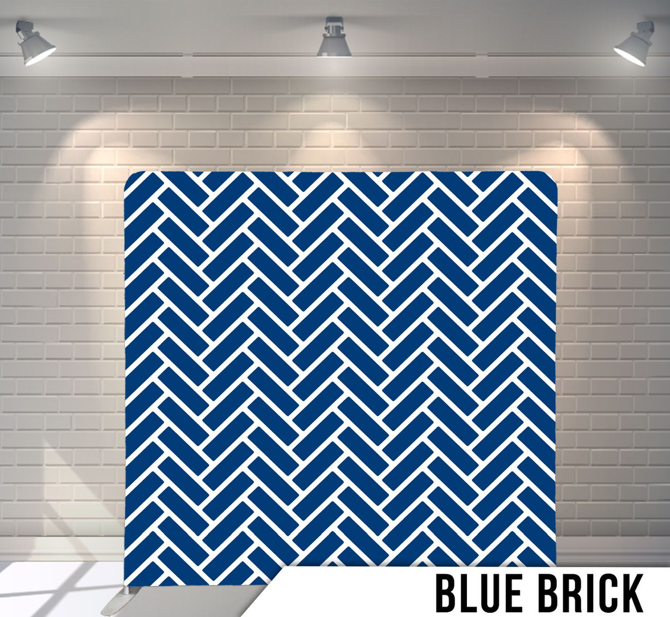 Navy blue and white herringbone pattern backdrop with geometric zigzag design.