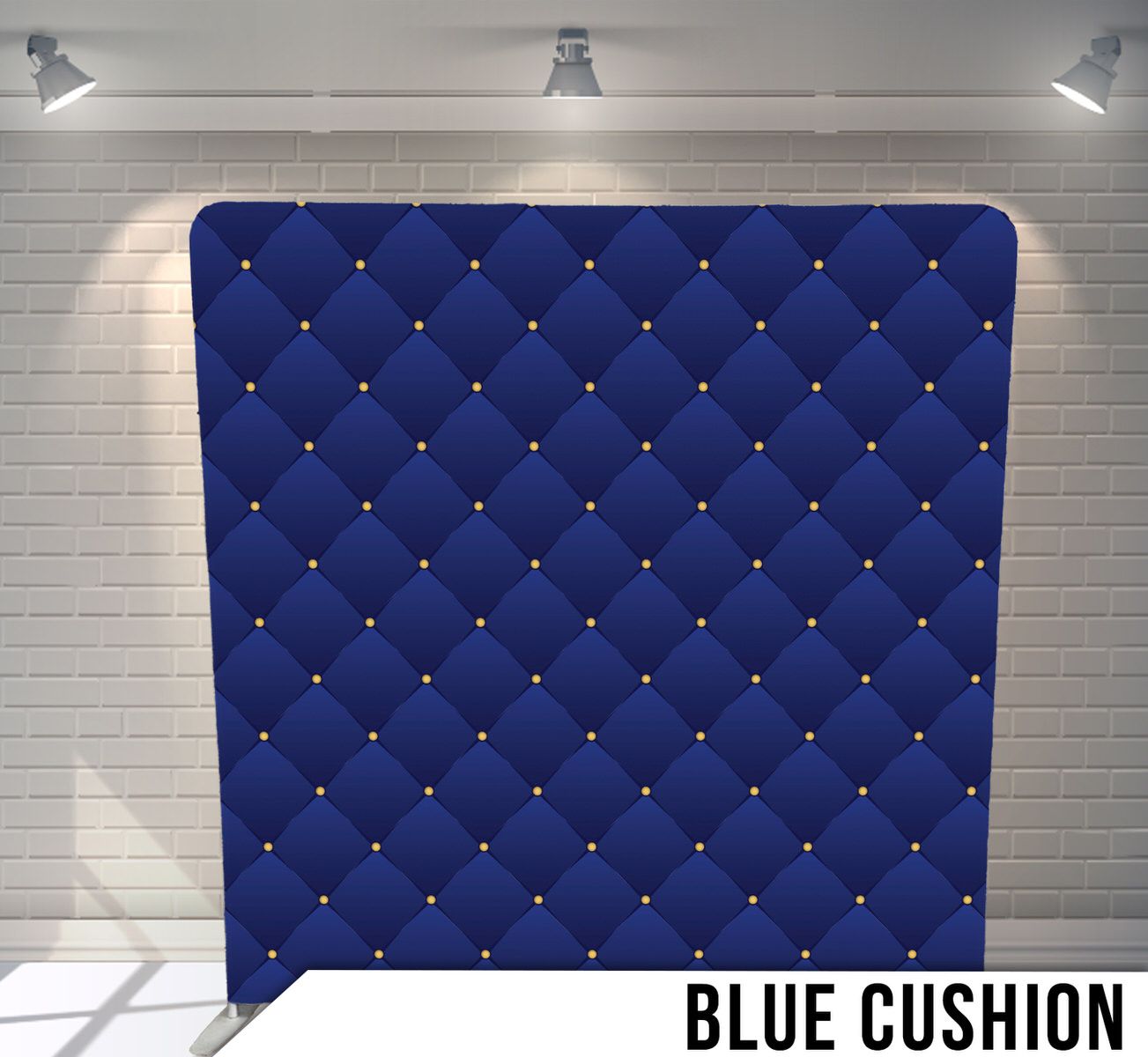 Royal blue tufted backdrop with diamond pattern and decorative button details.