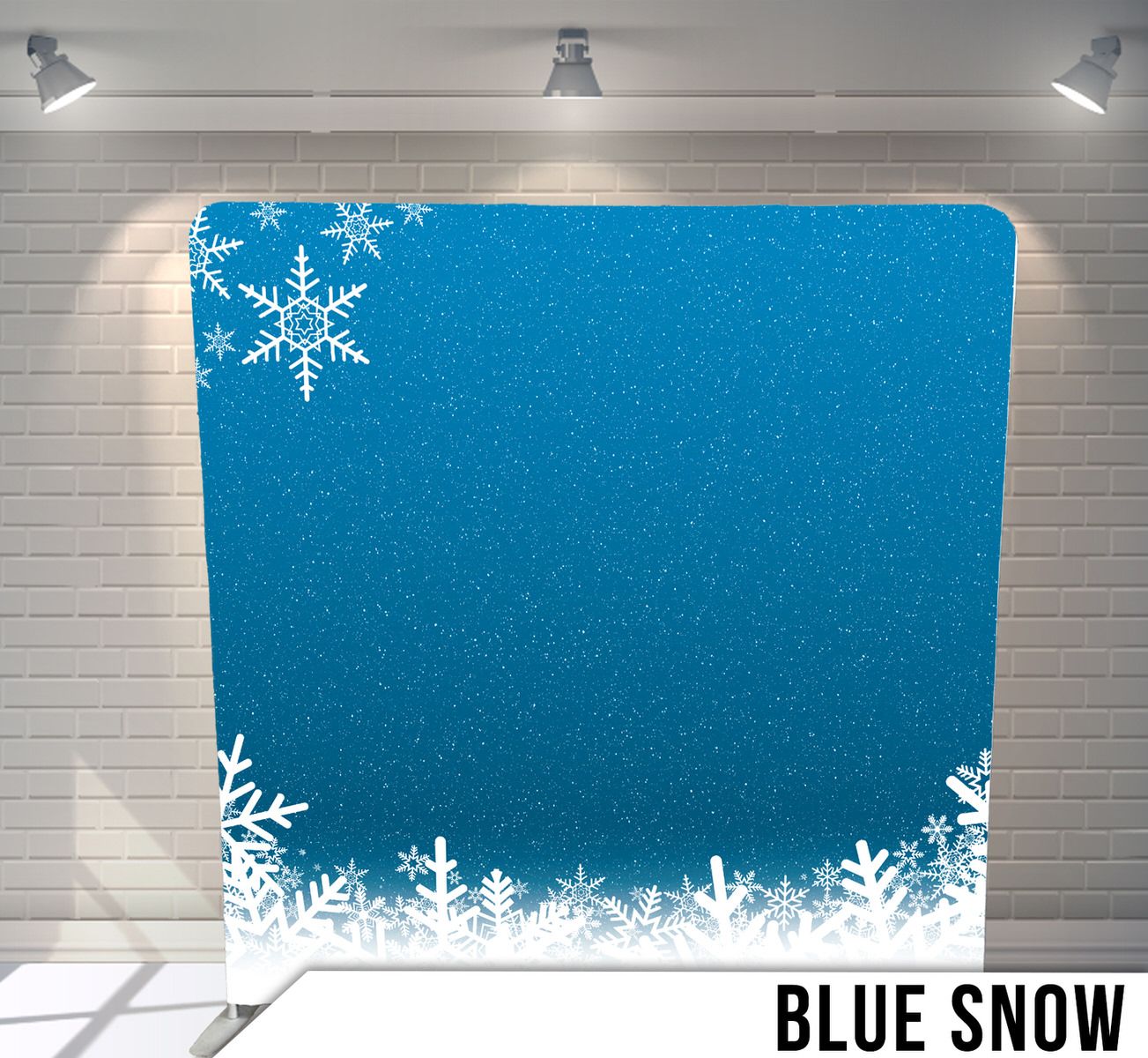 Winter-themed backdrop with white snowflake decorations on solid blue background.