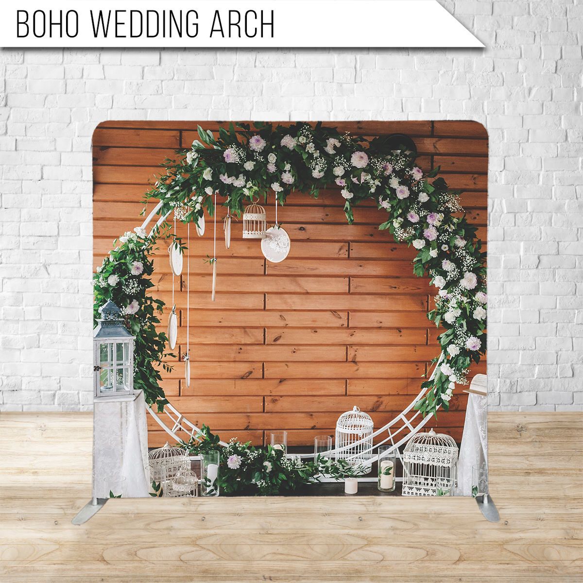 Rustic wooden wedding arch decorated with white flowers, greenery, and hanging lanterns.