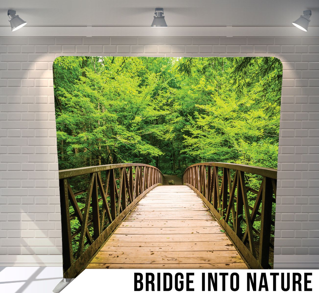 Wooden footbridge surrounded by lush green forest creating a peaceful nature path.