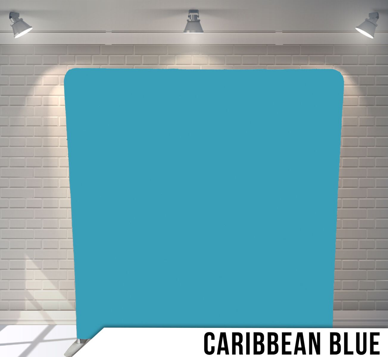 Solid Caribbean blue photography backdrop panel against white brick wall.