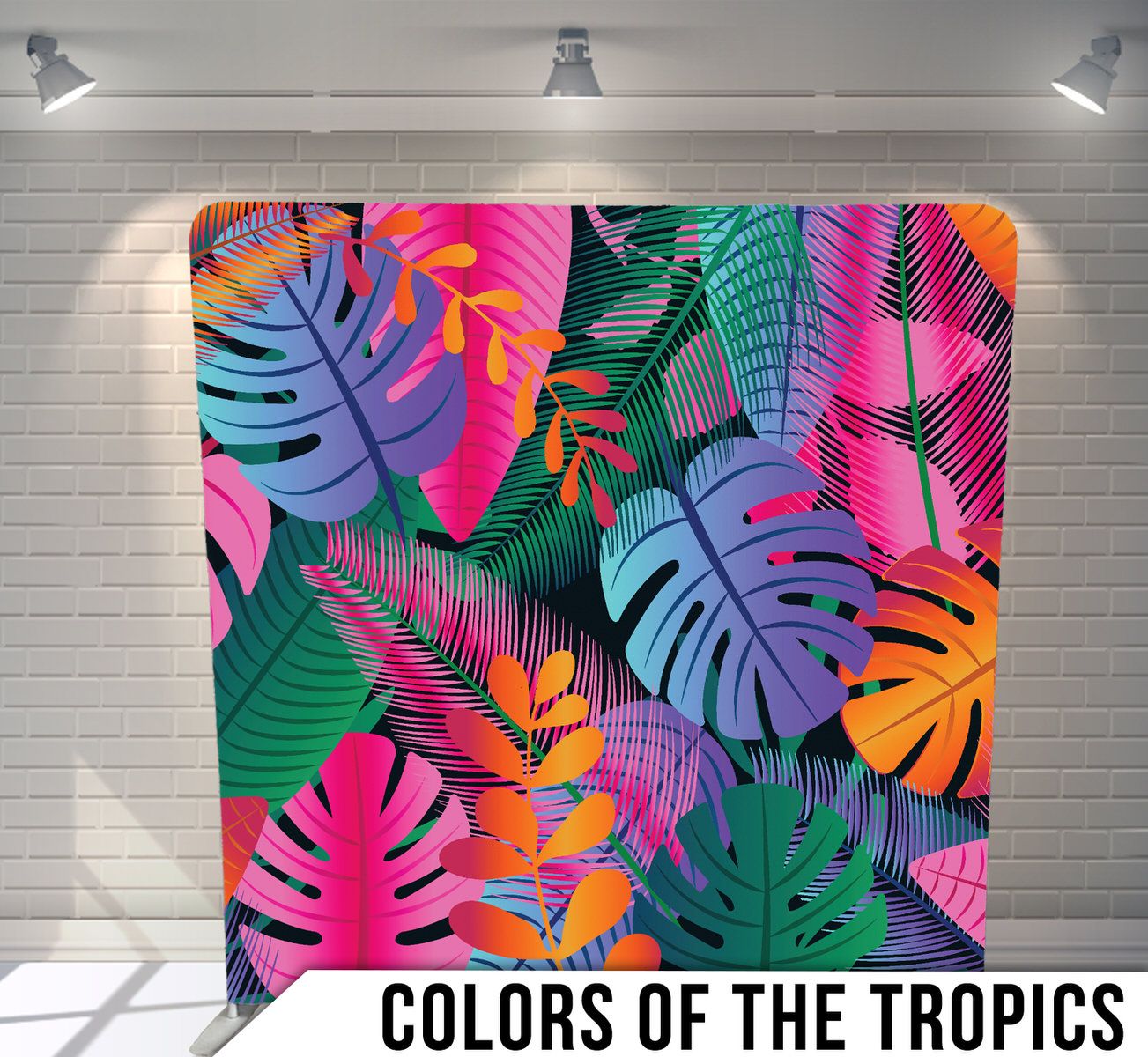 Vibrant tropical leaf pattern with monstera and palm fronds in pink, purple, orange and teal colors.