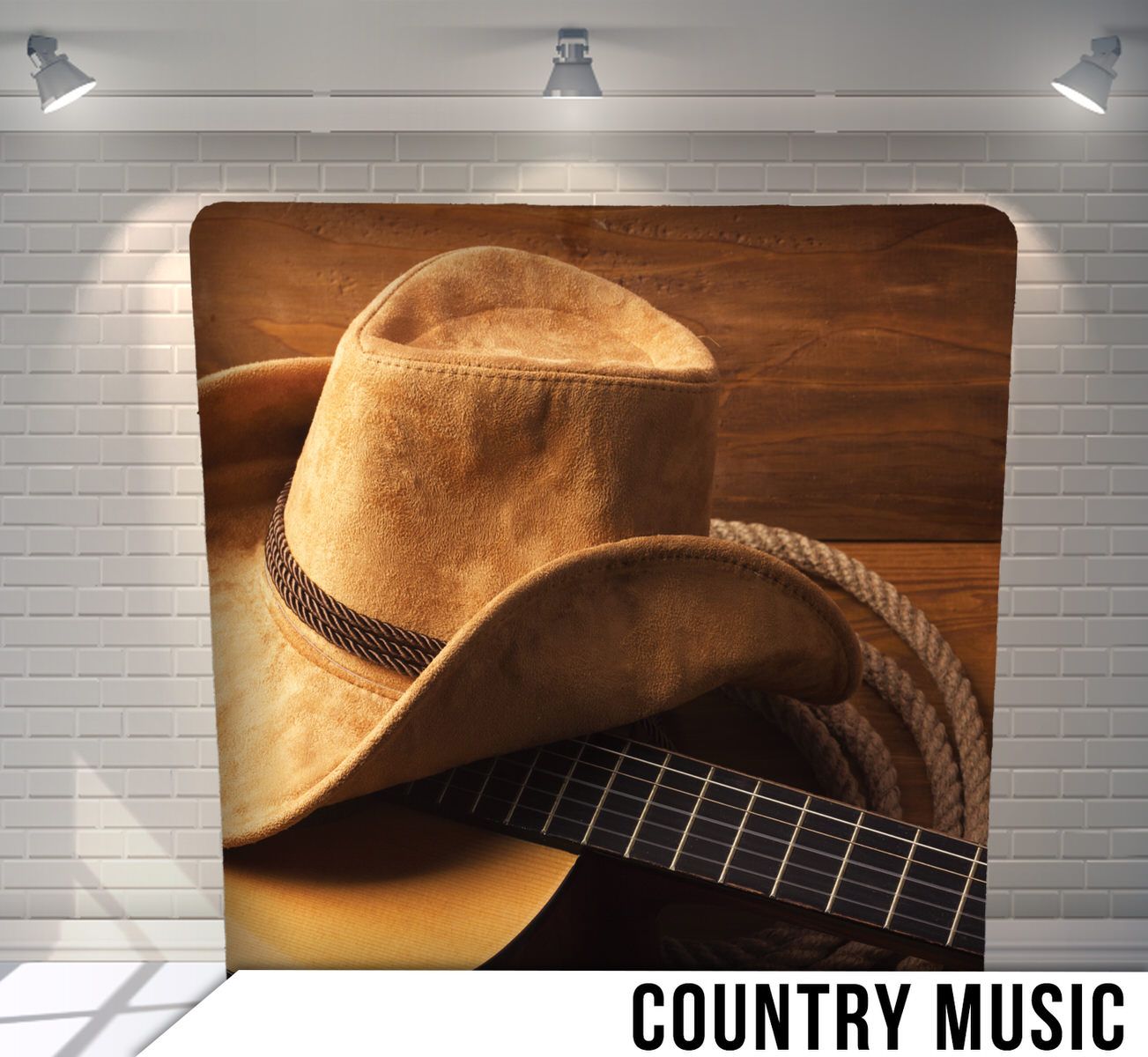 A brown cowboy hat rests on an acoustic guitar against a rustic wooden background.
