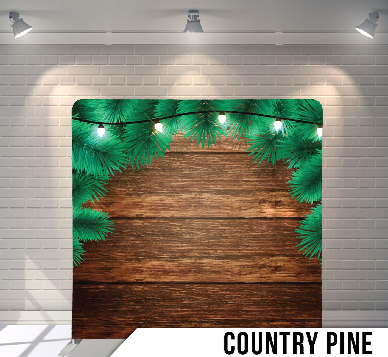 Pine branches with string lights frame a rustic wooden backdrop.