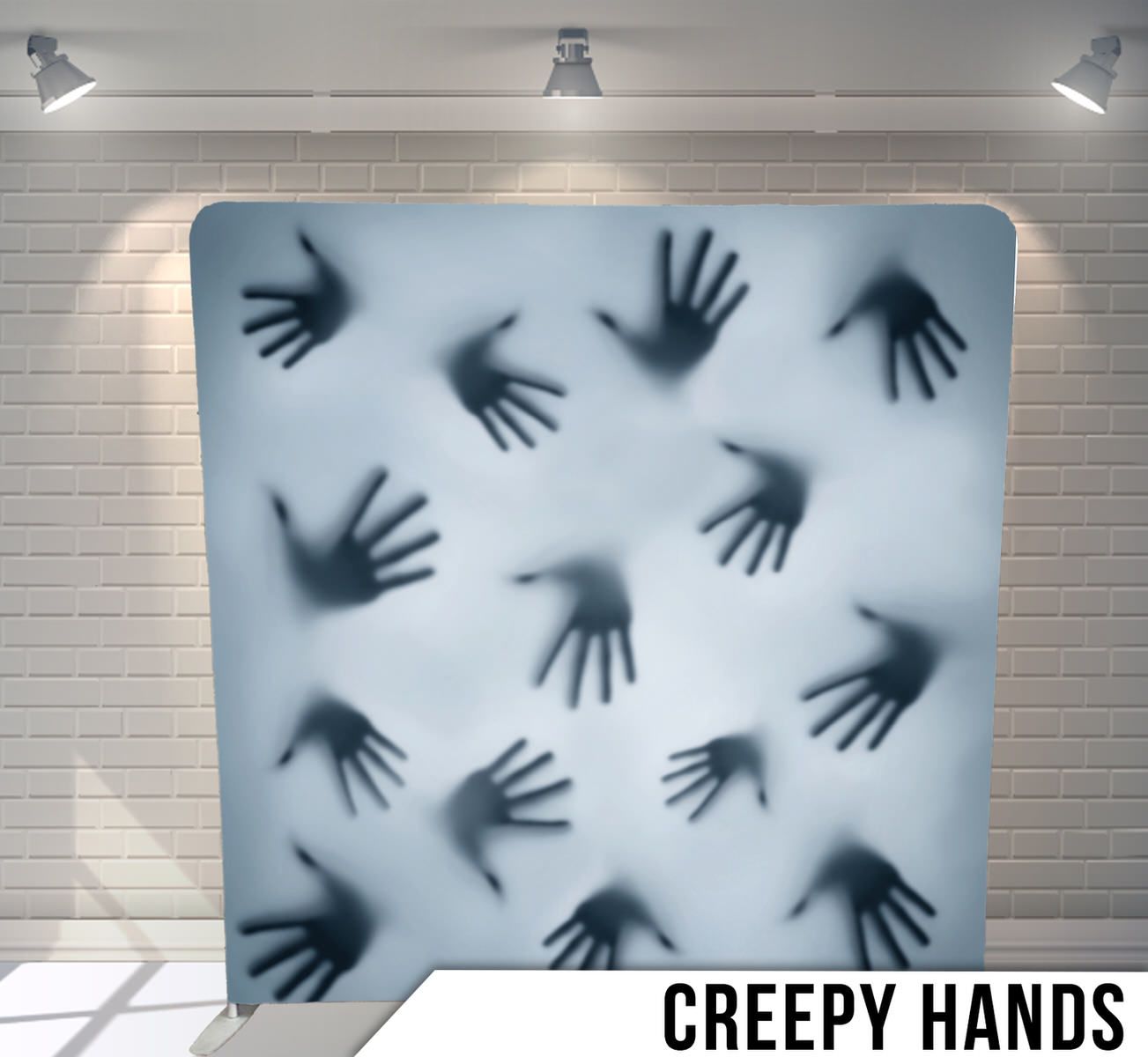 Silhouettes of mysterious hands pressed against a foggy white surface.