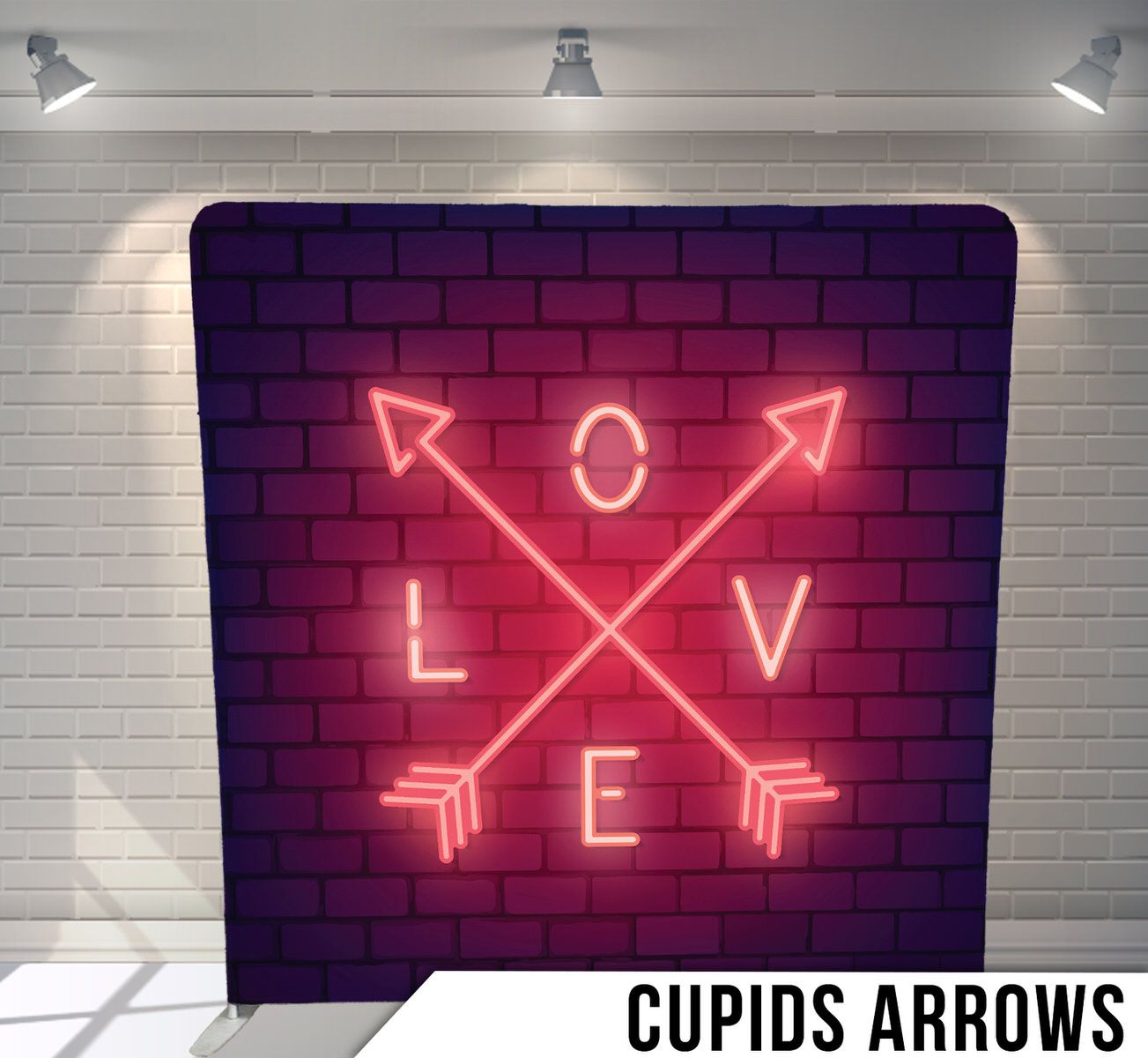 Neon love sign with crossed arrows glowing against purple brick wall.